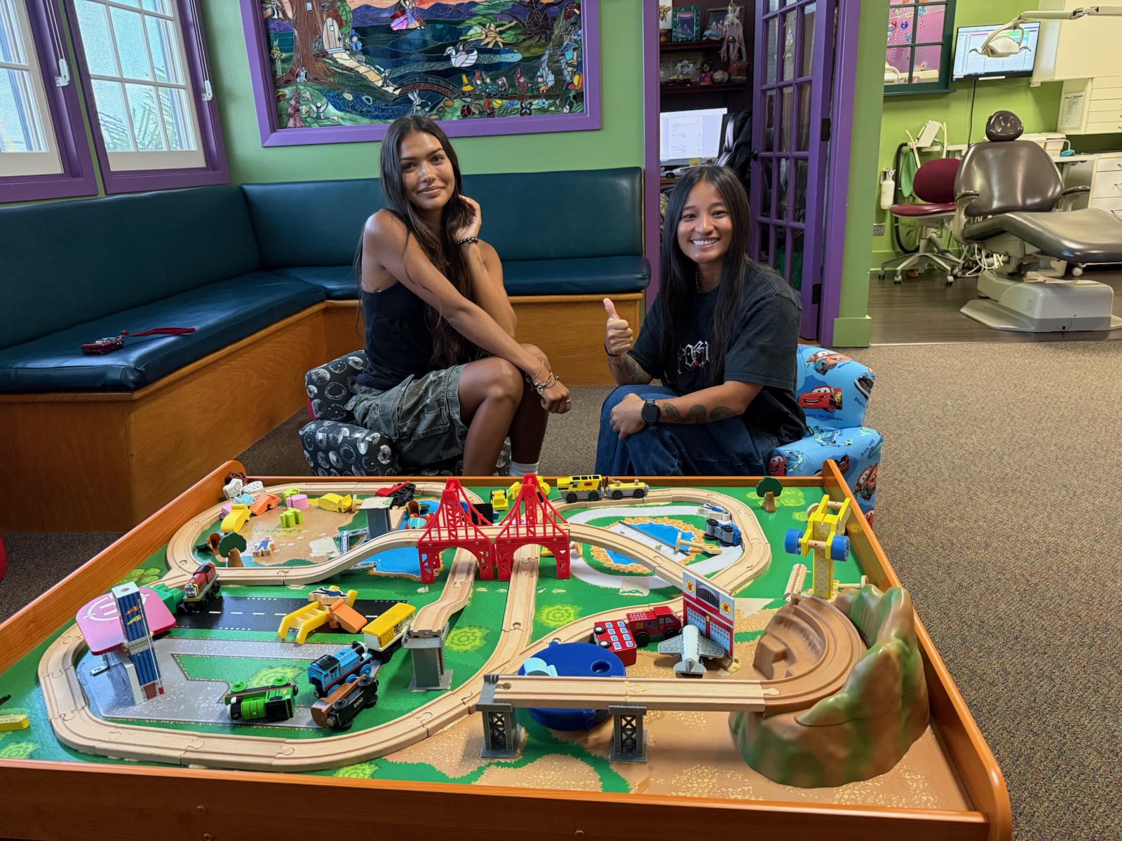 Family spending time together in the Kona Kids Dentist waiting room