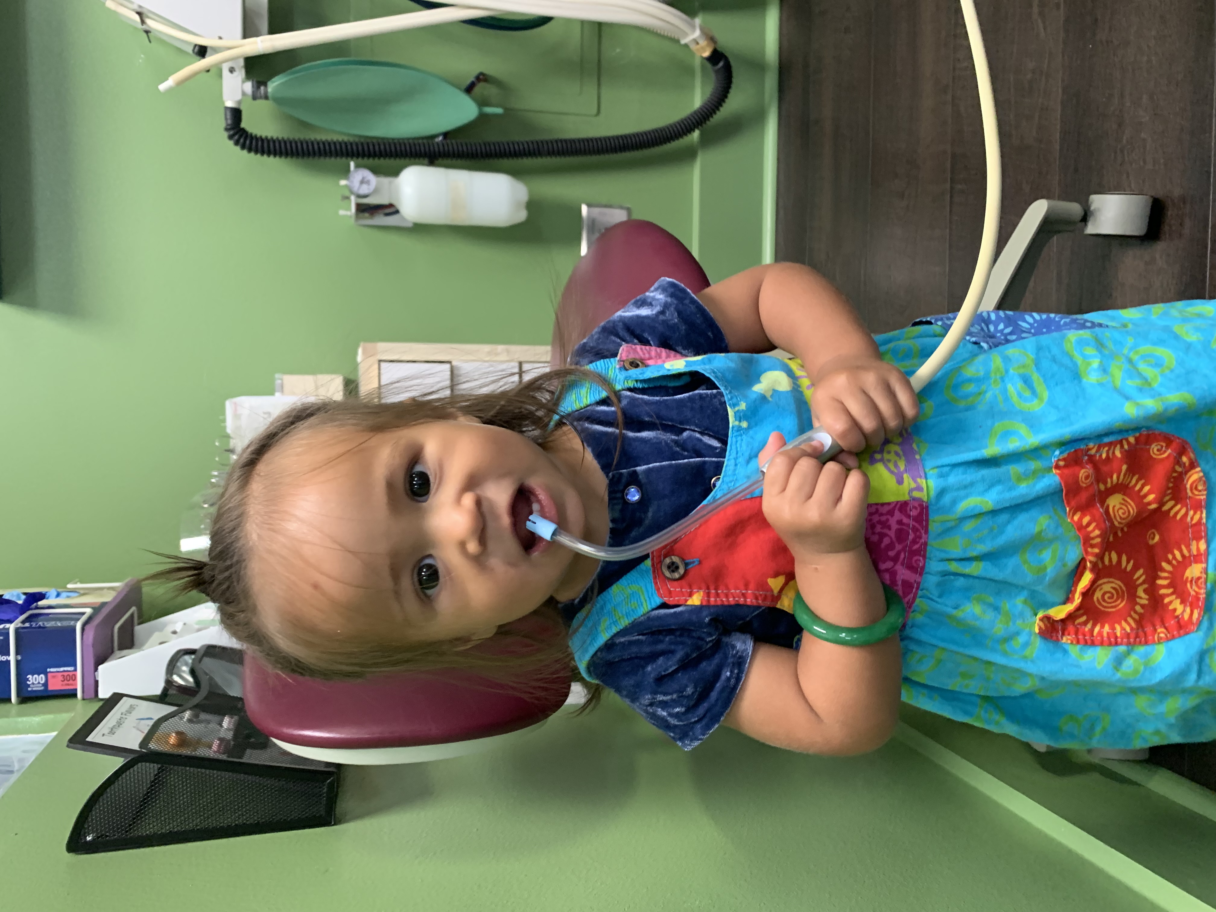 Young patient exploring a Kona Kids Dentist treatment room