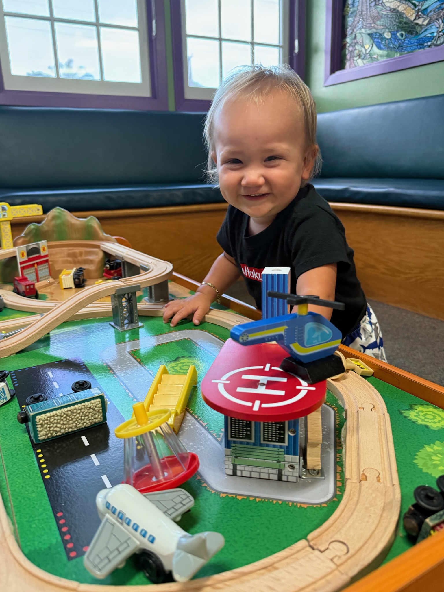 Young patient enjoying the Kona Kids Dentist waiting-area play table